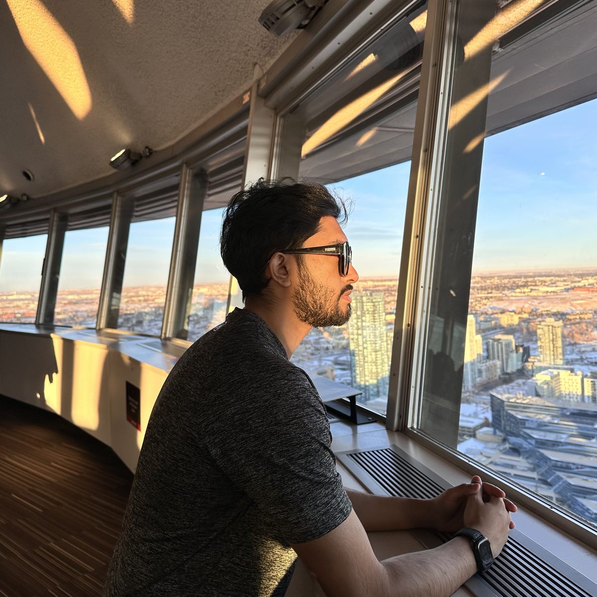 Looking out over Calgary at sunset from the Calgary Tower observation deck