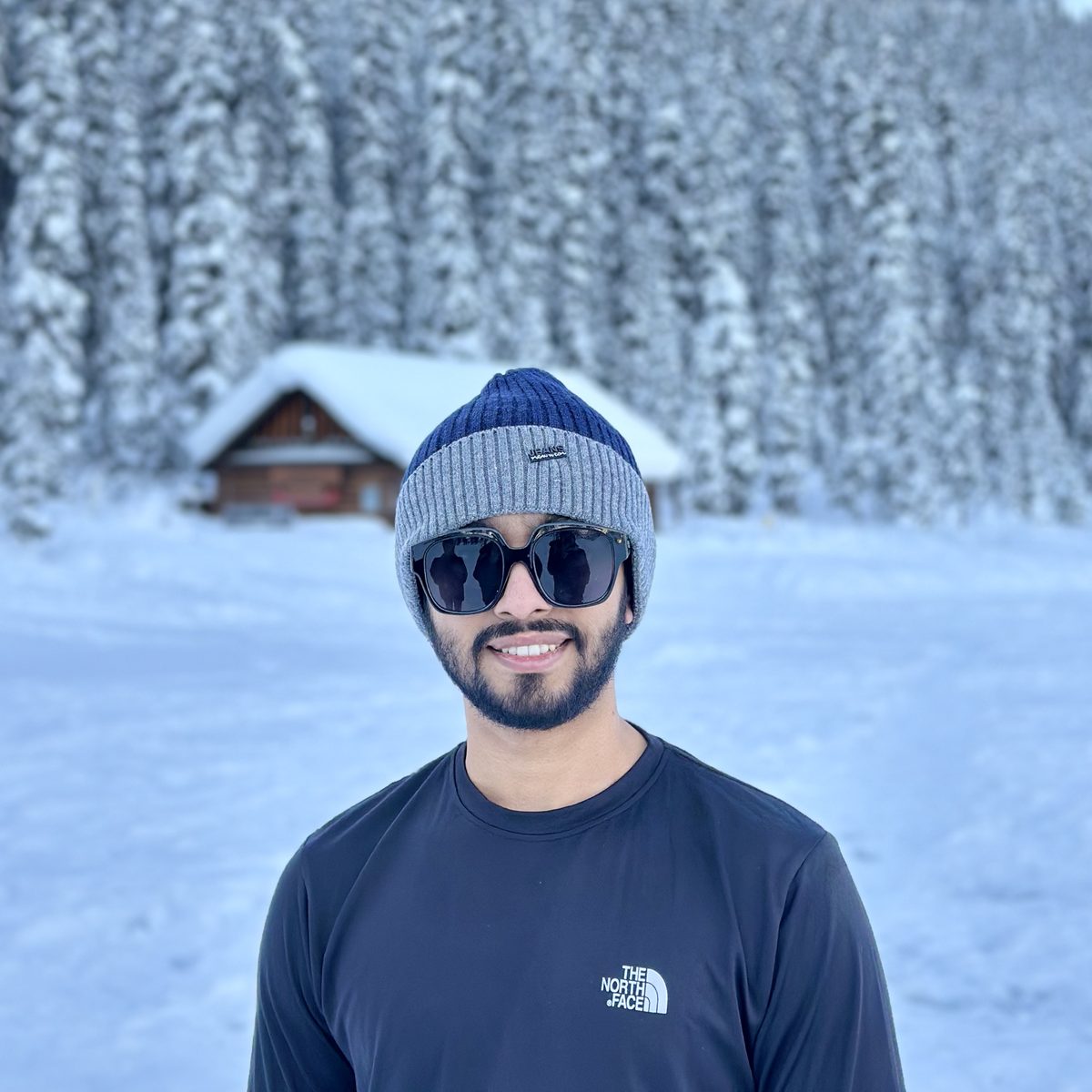 Standing in front of snow-covered pines in the Canadian Rockies